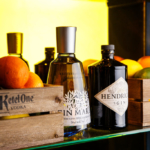 Gin bottles arranged on shelves behind the bar at a Mercure Hotel