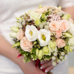 Pink bridal bouquet in bride's hands