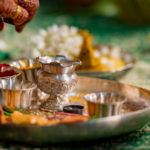 silver tray and hands in indian wedding ceremony ritual