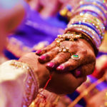 Indian Wedding Ceremony with bride and groom holding hands