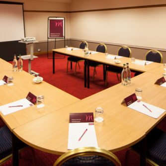Table and chairs ready for a meeting in the Tec West