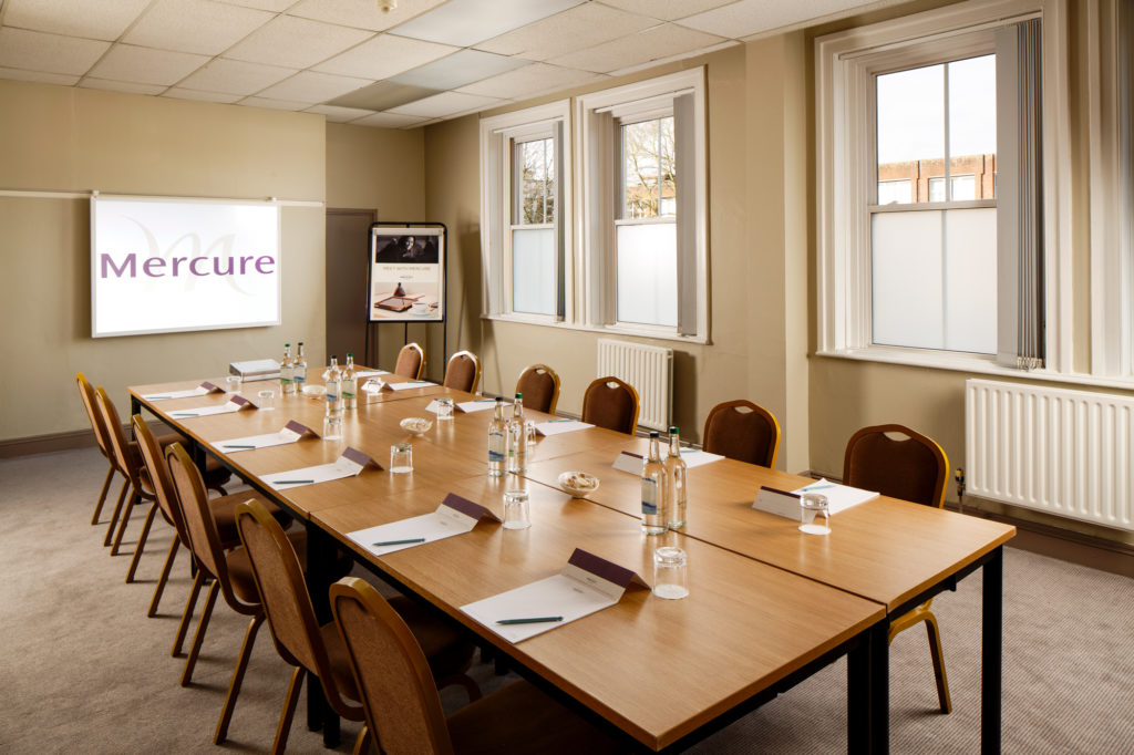 mercure-maidstone-great-danes-hotel-county-room-meeting-01-lr-290216 Table and chairs ready for a meeting in the county room at Mercure Maidstone Great Danes Hotel