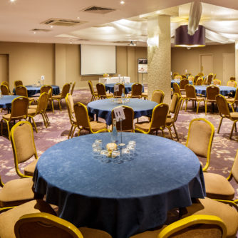 Tables set for a meeting in the hollingbourne suite at Mercure Maidstone Great Danes Hotel