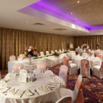 Tables set for a wedding breakfast in the hollingbourne suite at Mercure Maidstone Great Danes Hotel