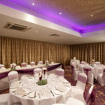 Tables set for a wedding breakfast in the hollingbourne suite at Mercure Maidstone Great Danes Hotel