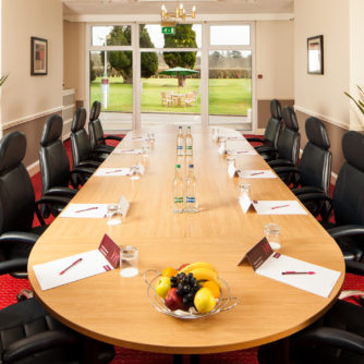 Table set for a meeting in Medway room overlooking the gardens at Mercure Maidstone Great Danes Hotel