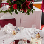 A table set in red for a wedding breakfast at Mercure Maidstone Great Danes Hotel