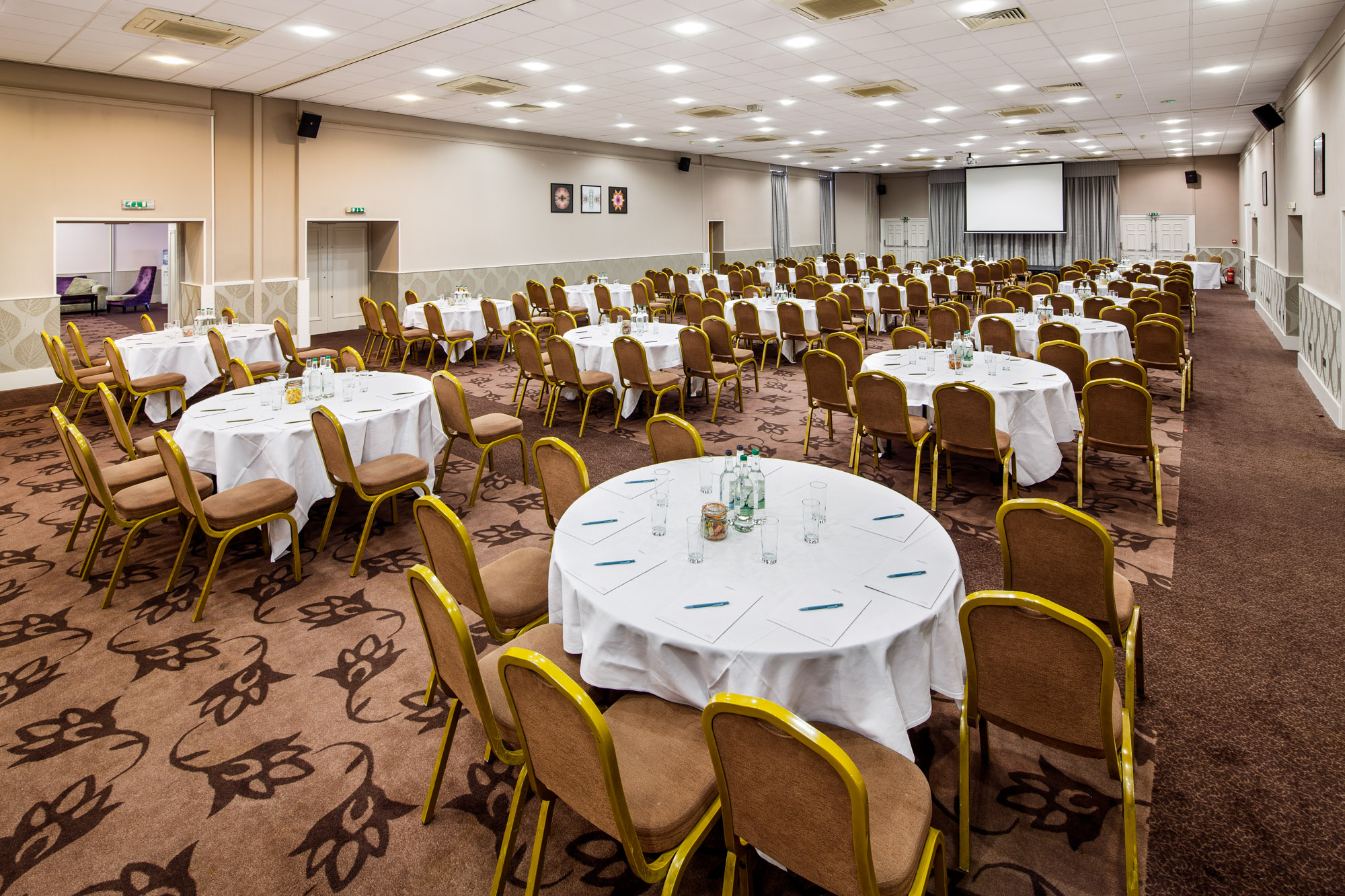 Mercure-Maidstone-Great-Danes-Hotel-Heart-of-Kent02_l Angled view of The Lakeside Suite at mercure gloucester bowden hall hotel ready for a conference and presentation on the large video screen