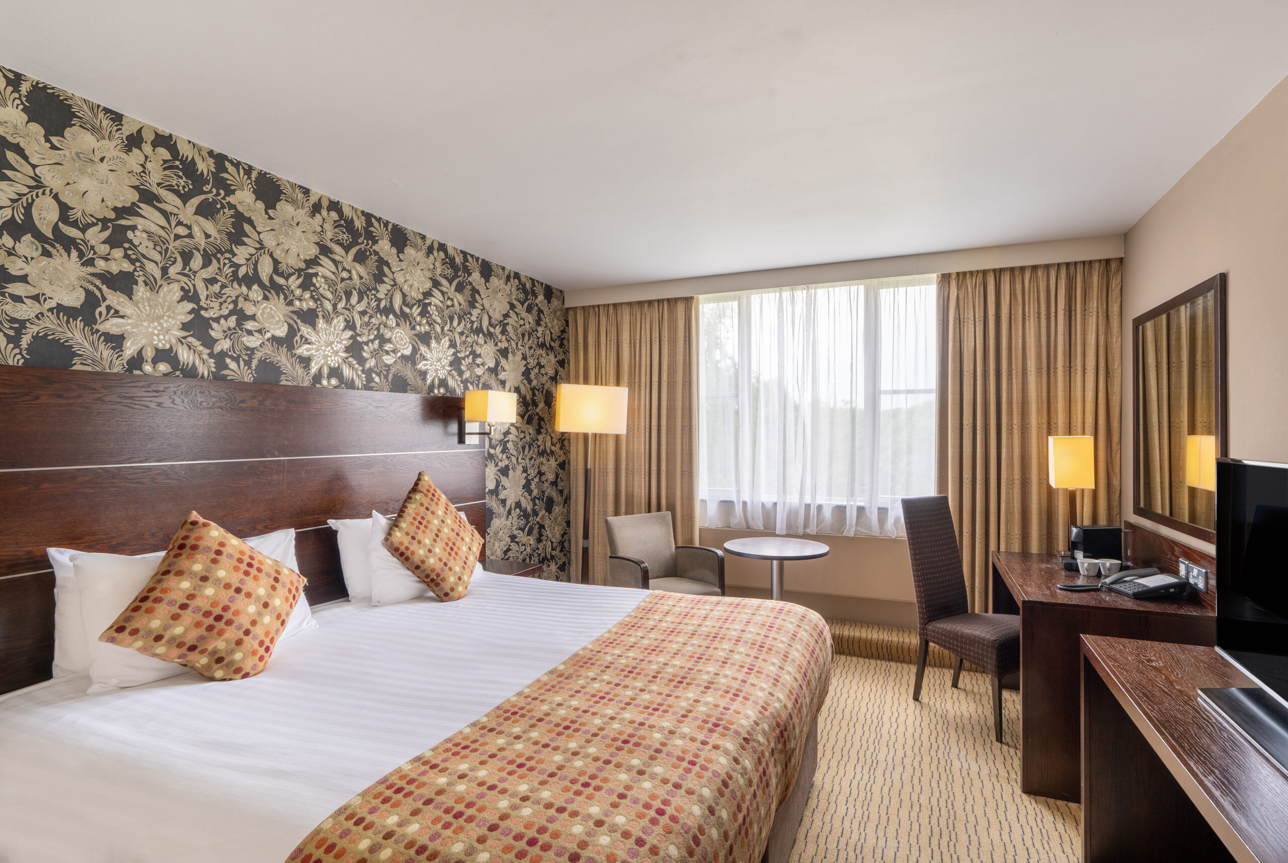 Double bed and headboard in a Privilege Room at Mercure Hotels