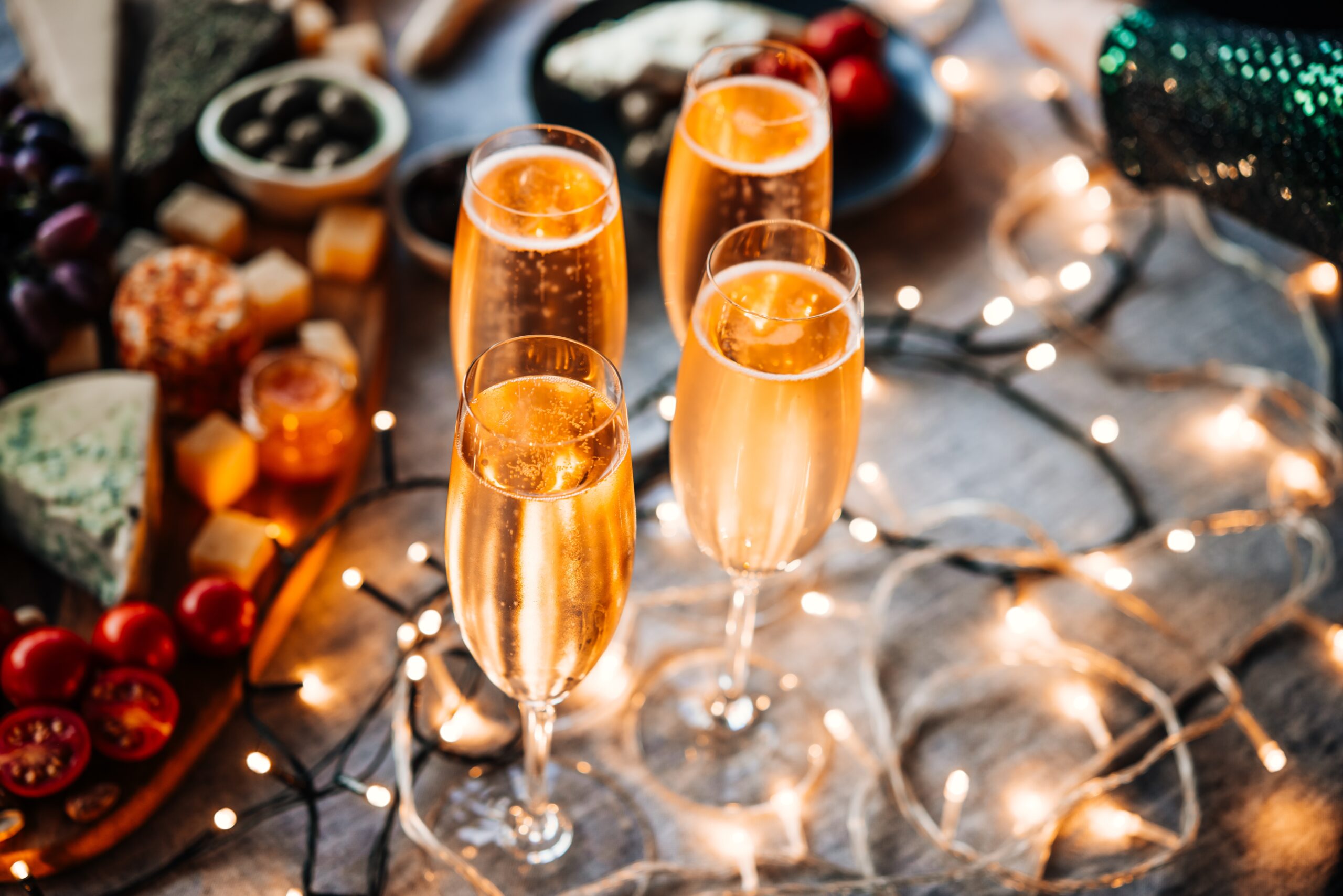 Glasses,Of,Sparkling,Wine,Or,Champagne,Served,On,The,Table People celebrating new years eve